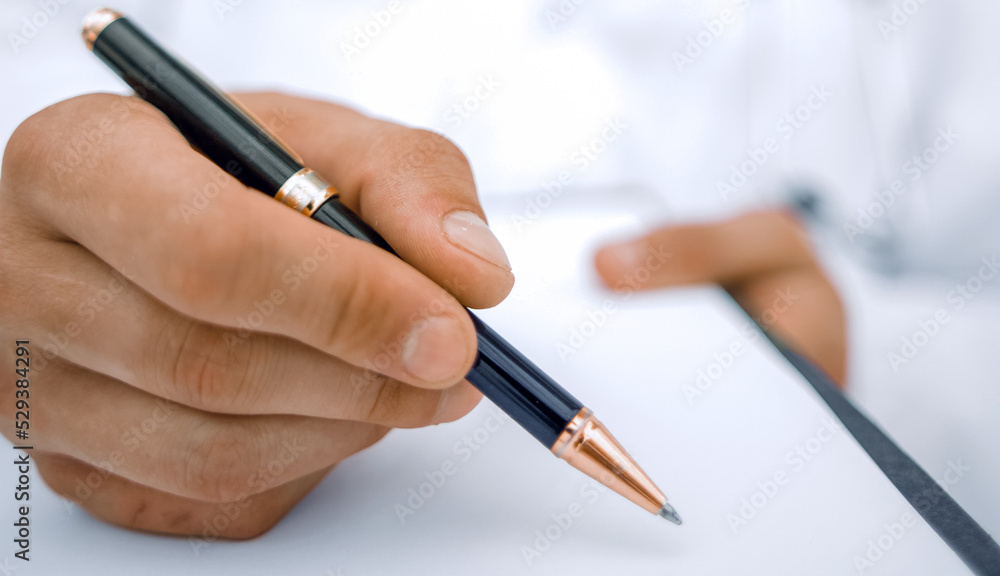 background image.the doctor signing the medical report. background image.the doctor signing the medical report.