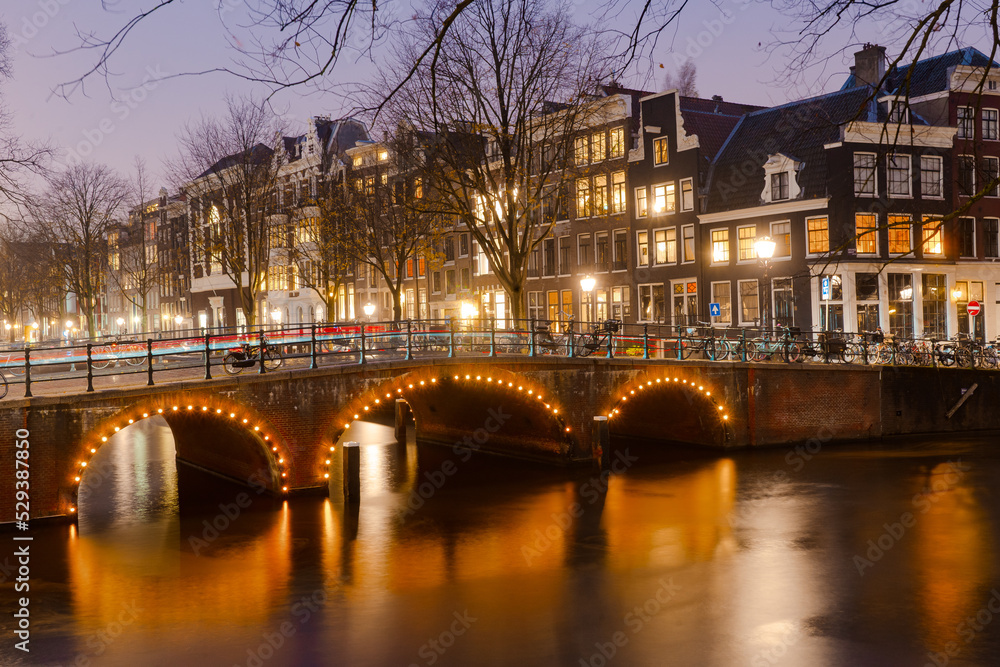 Nightscape along the canal and bridges in Amsterdam during winter : Amsterdam , Netherlands : November 26 , 2019