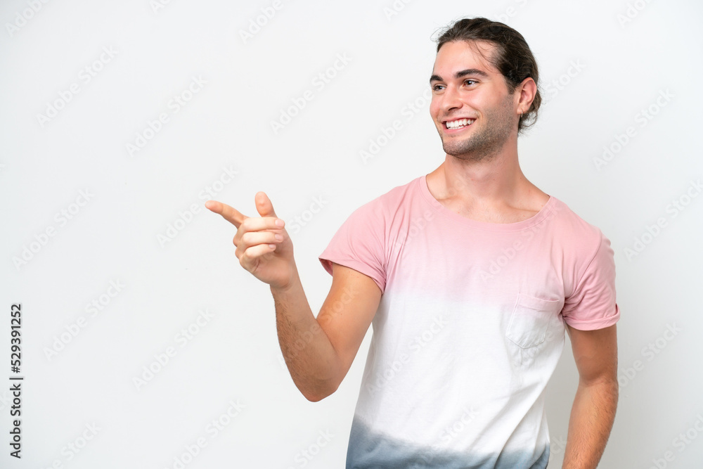 Caucasian handsome man isolated on white background pointing finger to the side and presenting a product Caucasian handsome man isolated on white background pointing finger to the side and presenting a product
