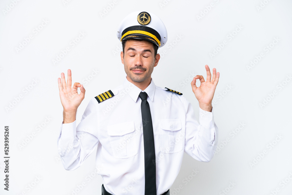 Airplane pilot over isolated white background in zen pose Airplane pilot over isolated white background in zen pose