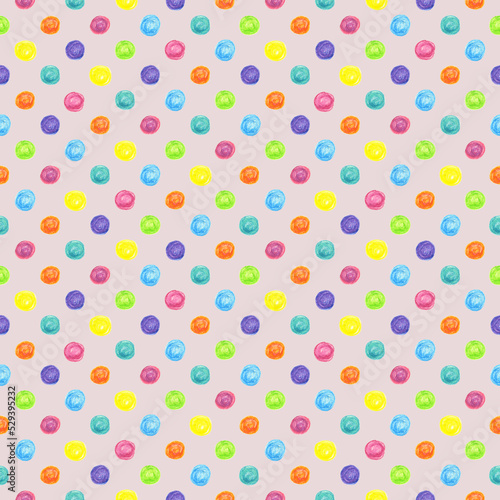 Seamless pattern bright colorful dots drawn with wax crayons on a light pink background. For fabric, sketchbook, wallpaper, wrapping paper.