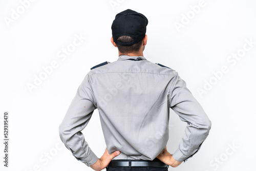 Fotografia Young safeguard man over isolated white background in back position