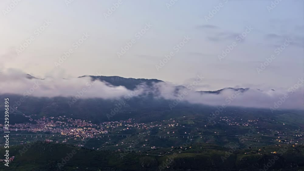Amazing hill terrain view of Sicily city in Italy. Clouds passing over the mountains. Amazing hill terrain view of Sicily city in Italy. Clouds passing over the mountains.