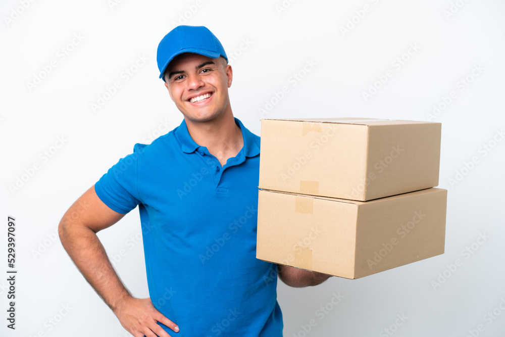 Delivery caucasian man isolated on white background posing with arms at hip and smiling Delivery caucasian man isolated on white background posing with arms at hip and smiling
