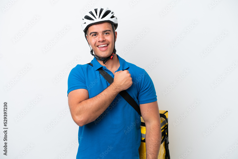 Young caucasian man with thermal backpack isolated on white background celebrating a victory Young caucasian man with thermal backpack isolated on white background celebrating a victory
