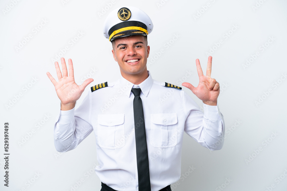Airplane pilot caucasian man isolated on white background counting eight with fingers Airplane pilot caucasian man isolated on white background counting eight with fingers