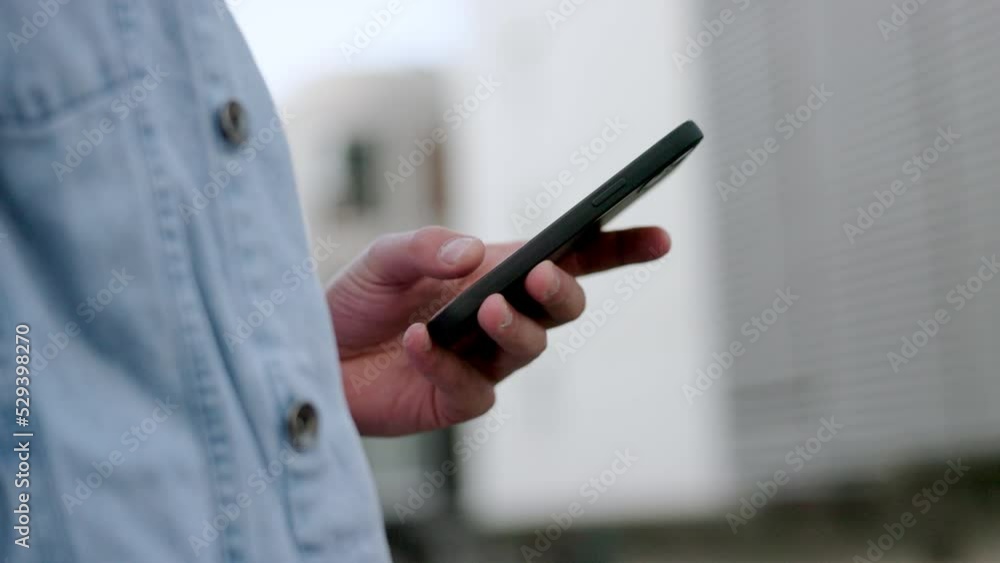 Hands, phone and communication with a man on social media, the internet or reading and sending a text message. 5g mobile technology and networking in the hand of a male standing outside in the city Hands, phone and communication with a man on social media, the internet or reading and sending a text message. 5g mobile technology and networking in the hand of a male standing outside in the city