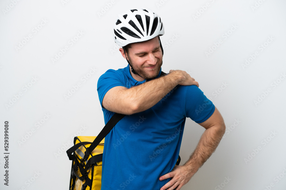 Young caucasian man with thermal backpack isolated on white background suffering from pain in shoulder for having made an effort Young caucasian man with thermal backpack isolated on white background suffering from pain in shoulder for having made an effort