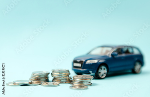 Kyiv, Ukraine. December 1, 2020 Blur Car SUV on coins background : Car loan, Finance, saving money, insurance and leasing time concepts.
