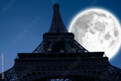 Large moon over Eiffel tower