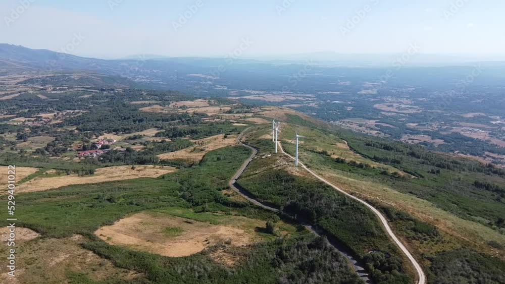 eolic generators spining with the wind in the mountains on a sunny day eolic generators spining with the wind in the mountains on a sunny day