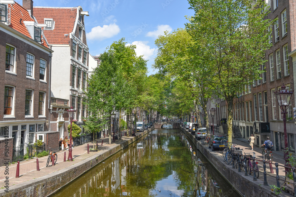 Fototapeta premium Amsterdam, Netherlands. August 2022. View of one of the canals in Amsterdam.
