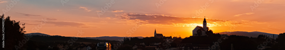 Beautiful sunrise view with two churches at Hengersberg, Bavaria, Germany Beautiful sunrise view with two churches at Hengersberg, Bavaria, Germany