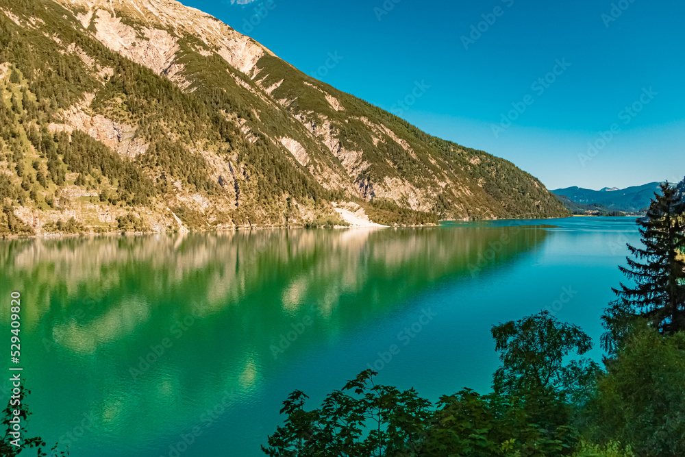 Naklejka premium Beautiful alpine summer view with reflections at the famous Achensee lake, Tyrol, Austria