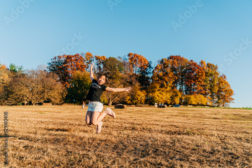 child running in autumn park