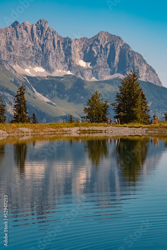 Beautiful alpine summer view with reflections in a lake at the famous Astberg summit  Going  Wilder Kaiser  Tyrol  Austria