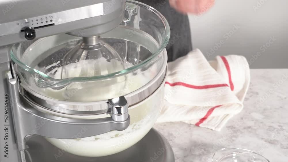 Step by step. Mixing ingredients in kitchen mixer to bake unicorn meringue pops cookies. Step by step. Mixing ingredients in kitchen mixer to bake unicorn meringue pops cookies.