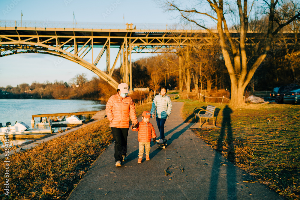 Fototapeta premium portrait of an asian girl playing at the park in autumn