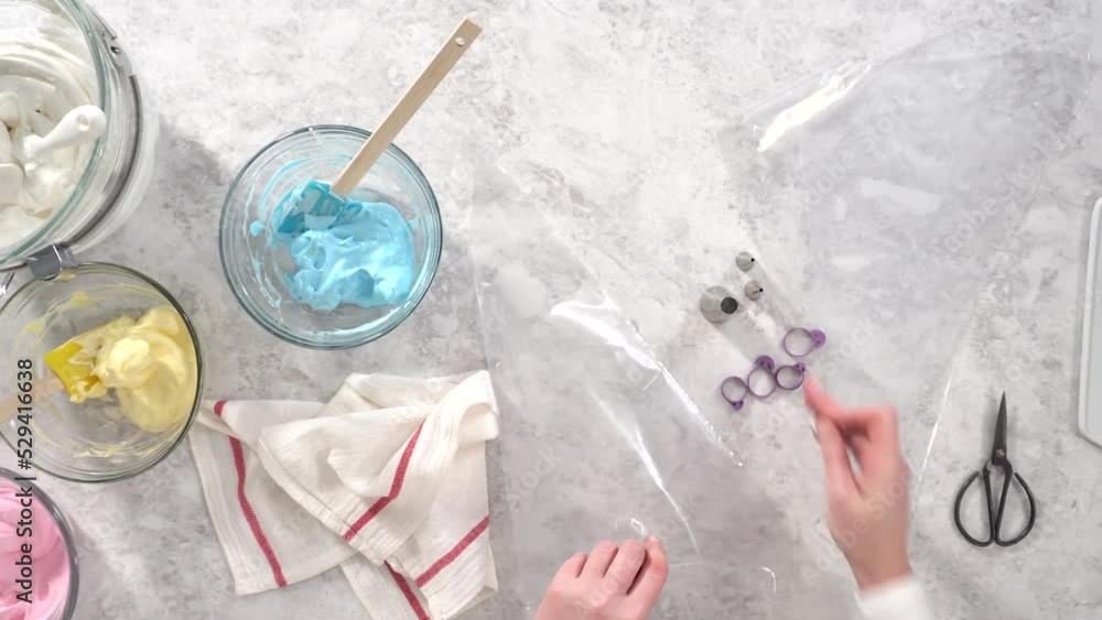 Flat lay. Step by step. Transfering meringue mix into piping bags with metal tips to bake unicorn meringue pops cookies. Flat lay. Step by step. Transfering meringue mix into piping bags with metal tips to bake unicorn meringue pops cookies.