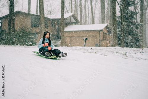 child playing outside in winter