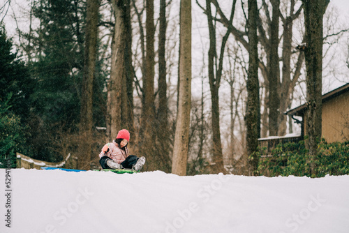 portrait of an asian girl playing in winter