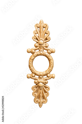 Metal vintage old door handle with gold color plant carving on a brown door