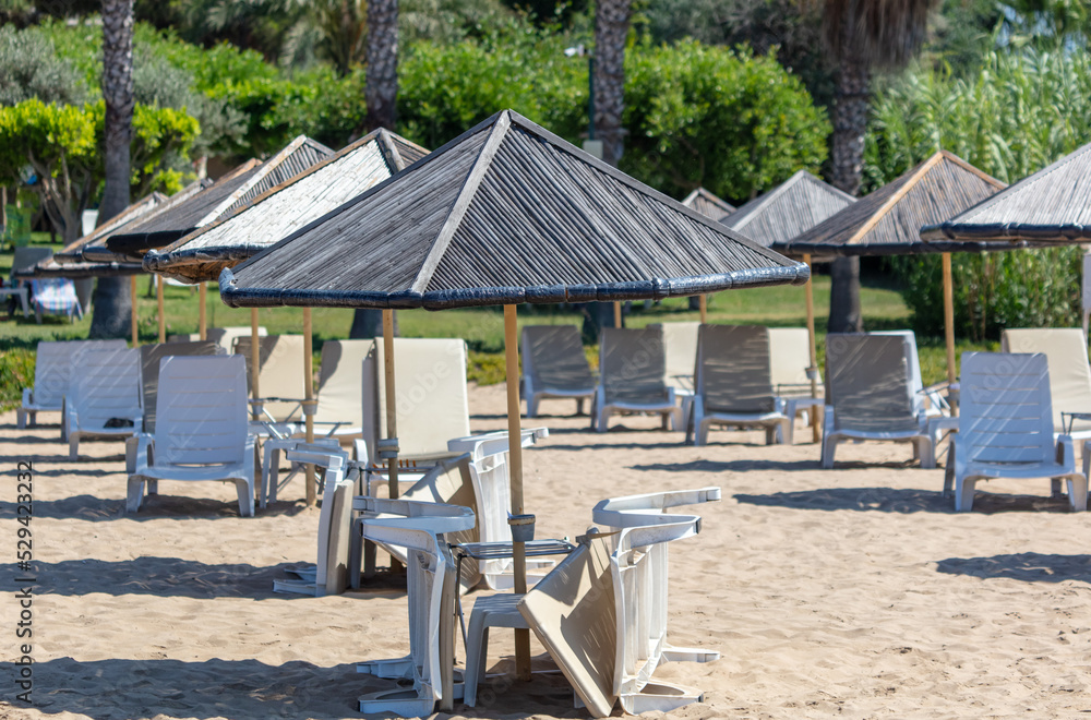 Sunbeds with sun loungers on the beach