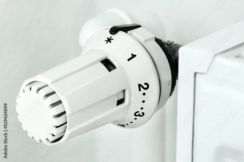 White heater and thermostat close up White heater and thermostat close up