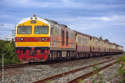 Passenger train by diesel locomotive on the railway 