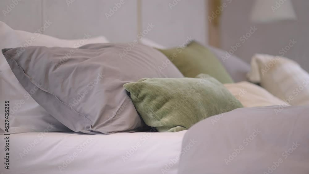 dolly shot of close up soft pillow arrange set on king size bed with nature sun light from window,bedroom pillow house design interior ideas background of contemporary home decorative detail dolly shot of close up soft pillow arrange set on king size bed with nature sun light from window,bedroom pillow house design interior ideas background of contemporary home decorative detail