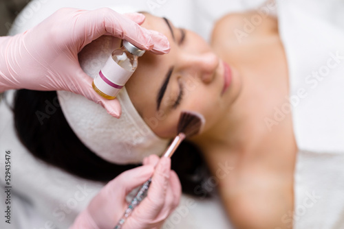 Chemical Peel Face Treatment with Retinol Serum. photo