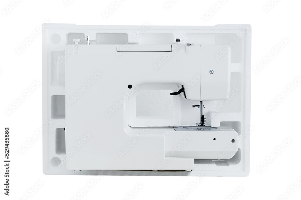 White sewing machine in  package. White isolate.