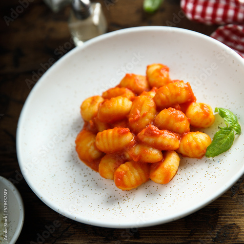 Traditional homemade potato gnocchi with tomato sauce