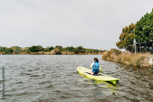 person kayaking in the river