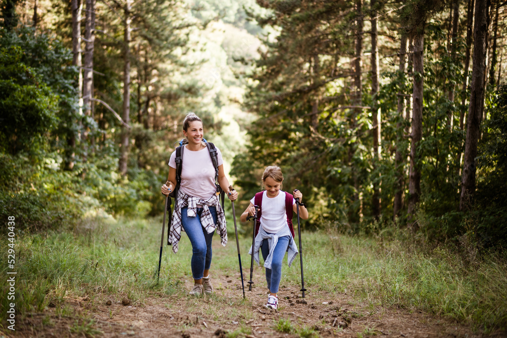 Mother and daughter enjoy hiking together. Mother and daughter enjoy hiking together.