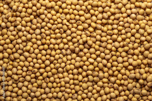 Heap of soy as background, top view