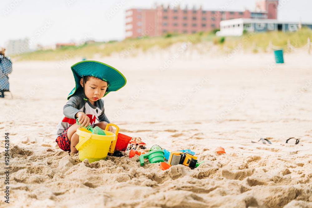 portrait of an asian cute boy playing at the beach portrait of an asian cute boy playing at the beach