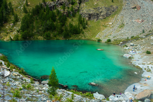 The crystal clear water of the Blue Lake of Ayes, Italian Alps