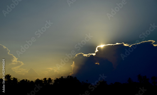 Ray of the sun at sunset sky background