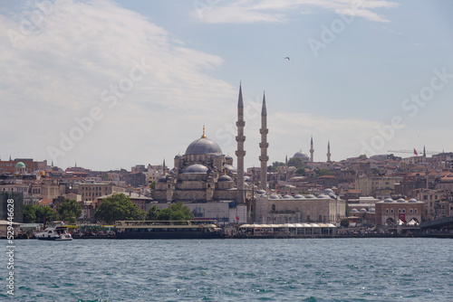 Istanbul / Turkey - 12 June 2022: Eminonu port with the Hagia Sophia museum in the background, Istanbul, Turkey
