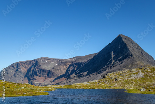 lake in front of a high mountain, hiking the kungsleden in swedish lapland
