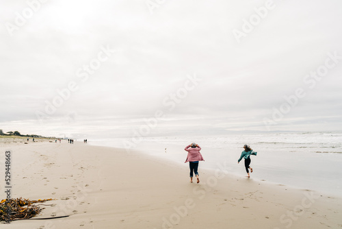 children running on the beach