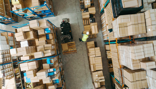 High angle view of a warehouse employee moving goods photo