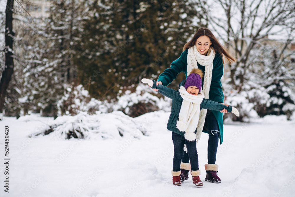 Mother and daughter in winter park Mother and daughter in winter park