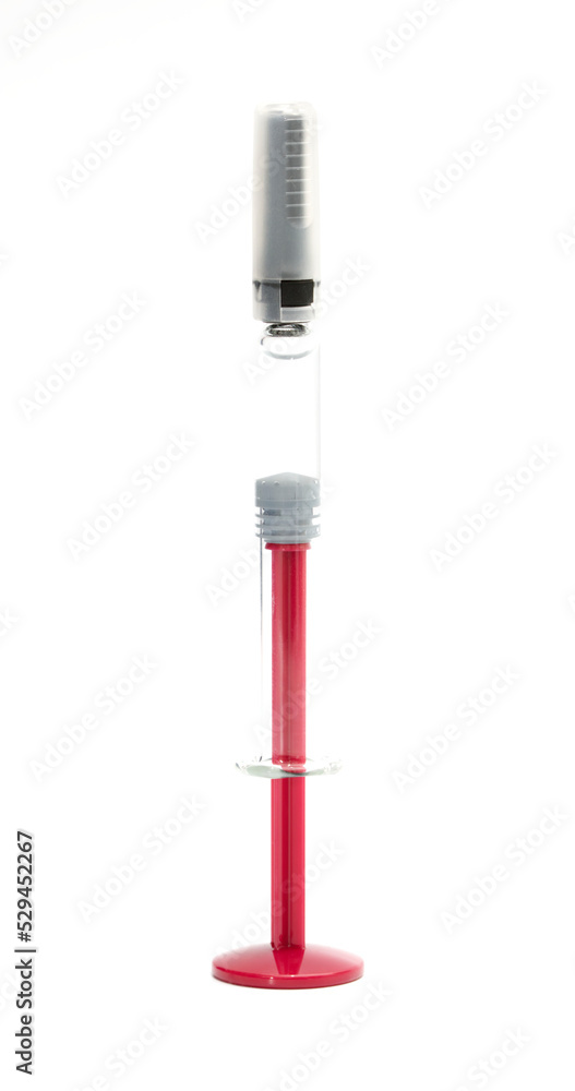 Medical syringe for liquid 1 ml. Red medical syringe with a cap, isolated on a white background. Medical syringe for liquid 1 ml. Red medical syringe with a cap, isolated on a white background.