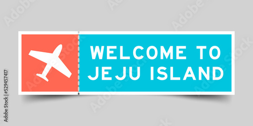 Orange and blue color ticket with plane icon and word welcome to jeju island on gray background