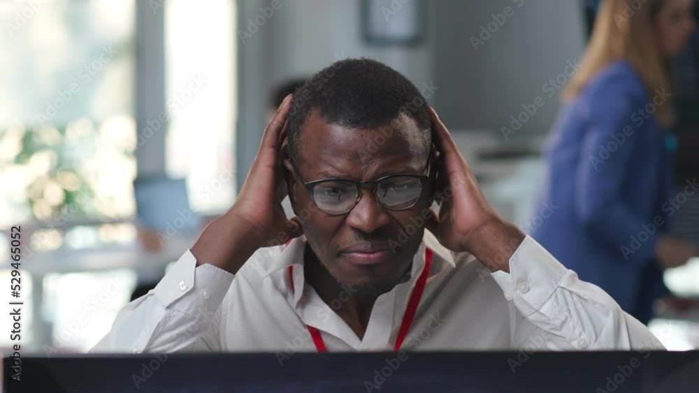 Close up portrait of stressed African-American trader losing money in stock market Close up portrait of stressed African-American trader losing money in stock market