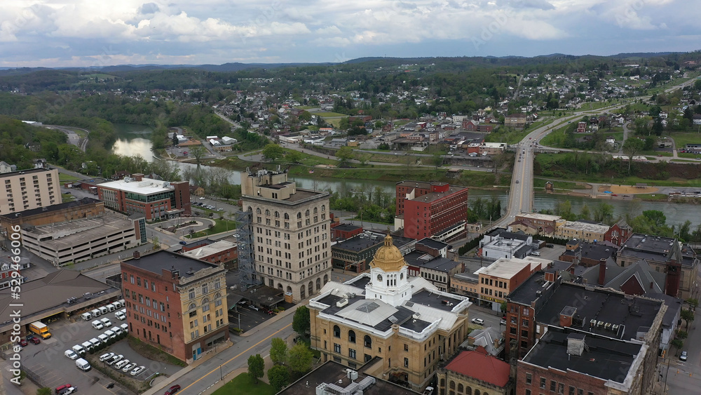 The Marion County courthouse in Fairmont, WV, and the surrounding small town river and countryside in the appalachian mountains.