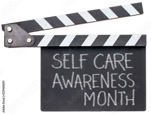 self care awareness month - white chalk writing on a clapboard, reminder of an annual event