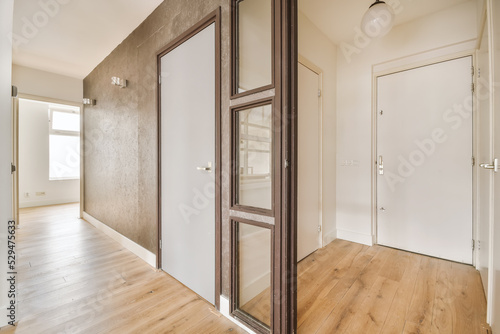 Wallpaper Mural Illuminated corridor with closed door in house entrance Torontodigital.ca